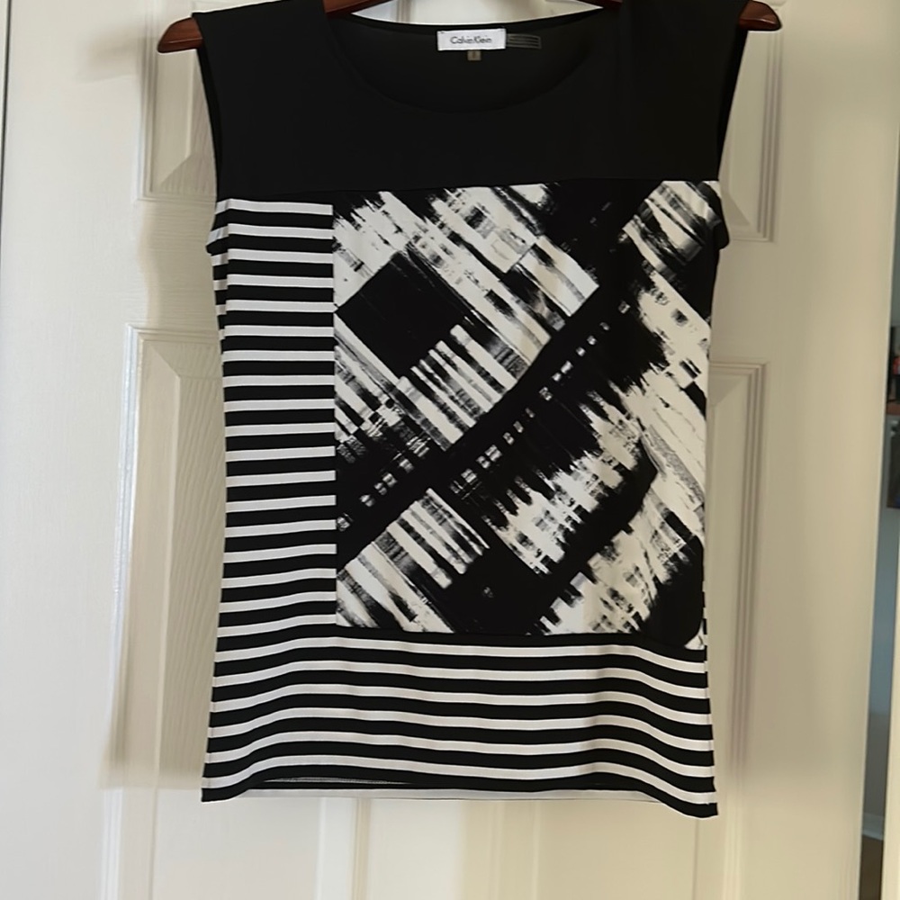 Calvin Klein. Black and white knit blouse